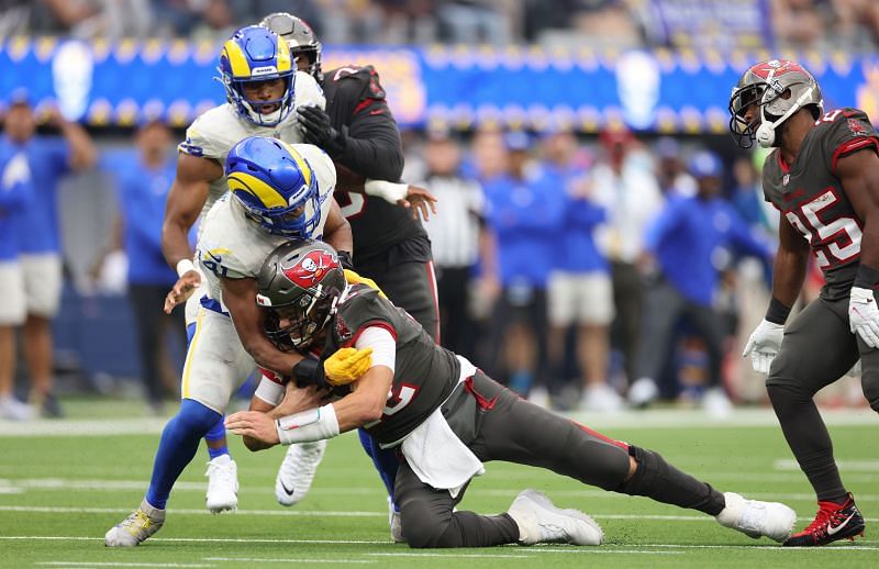 Tom Brady of the Tampa Bay Buccaneers getting sacked against the Los Angeles Rams