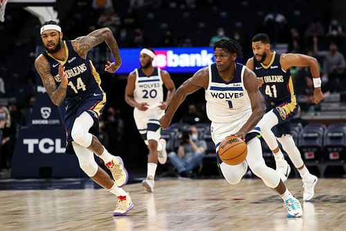 Anthony Edwards #1 of the Minnesota Timberwolves dribbles the ball past Brandon Ingram #14 of the New Orleans Pelicans