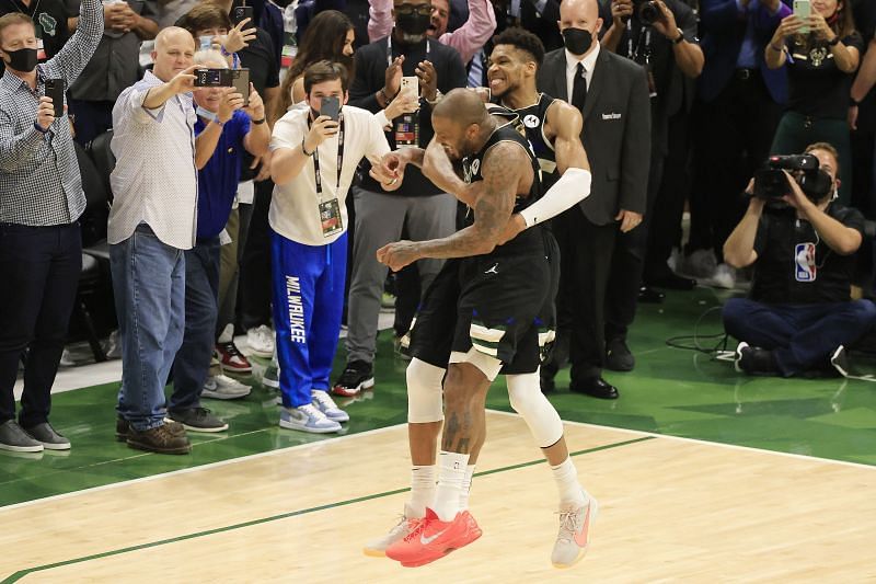 Giannis Antetokounmpo #34 of the Milwaukee Bucks celebrates with teammate P.J. Tucker #17 of the Milwaukee Bucks in the final second before defeating the Phoenix Suns in Game Six to win the 2021 NBA Finals at Fiserv Forum on July 20, 2021 in Milwaukee, Wisconsin.
