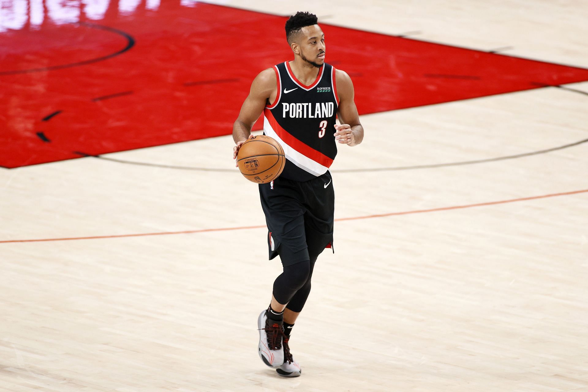CJ McCollum #3 of the Portland Trail Blazers dribbles against the Denver Nuggets during Round 1, Game 4 of the 2021 NBA Playoffs at Moda Center on May 29, 2021 in Portland, Oregon.
