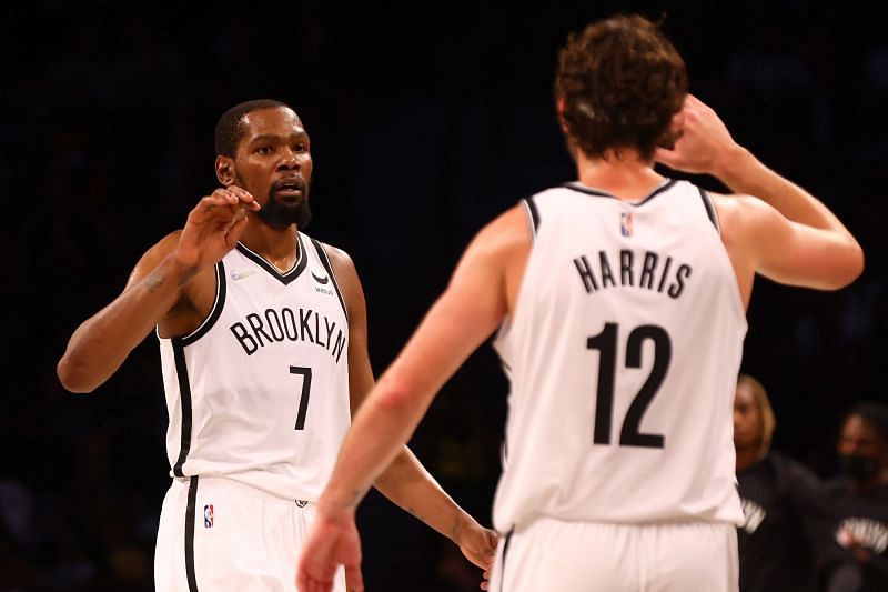 Kevin Durant (#7) of the Brooklyn Nets celebrates with Joe Harris (#12).