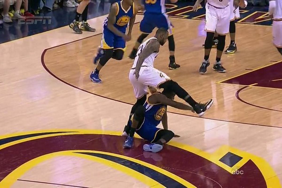 LeBron James steps over Draymond Green during the 2016 NBA Finals