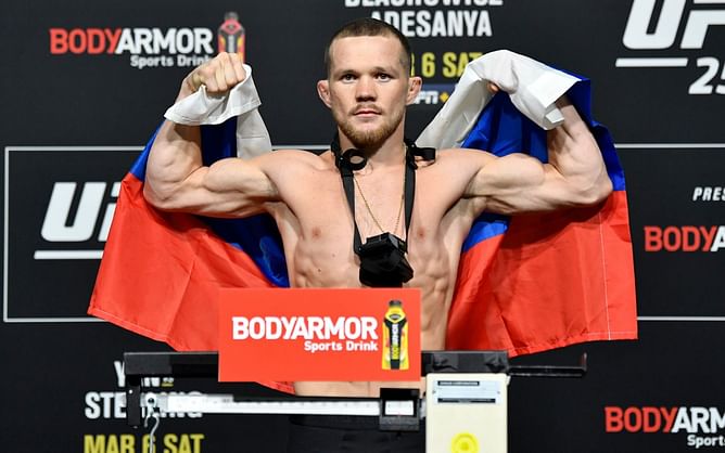 Watch: Petr Yan play-wrestles with a child; gets submitted via armbar