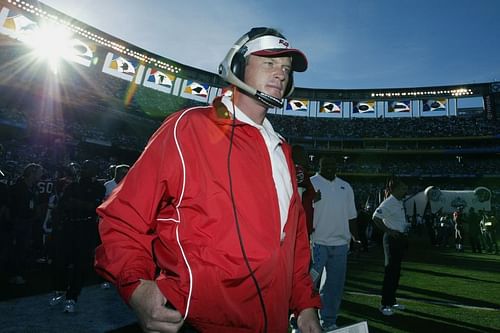 Jon Gruden walks onto the field at Super Bowl XXXVII