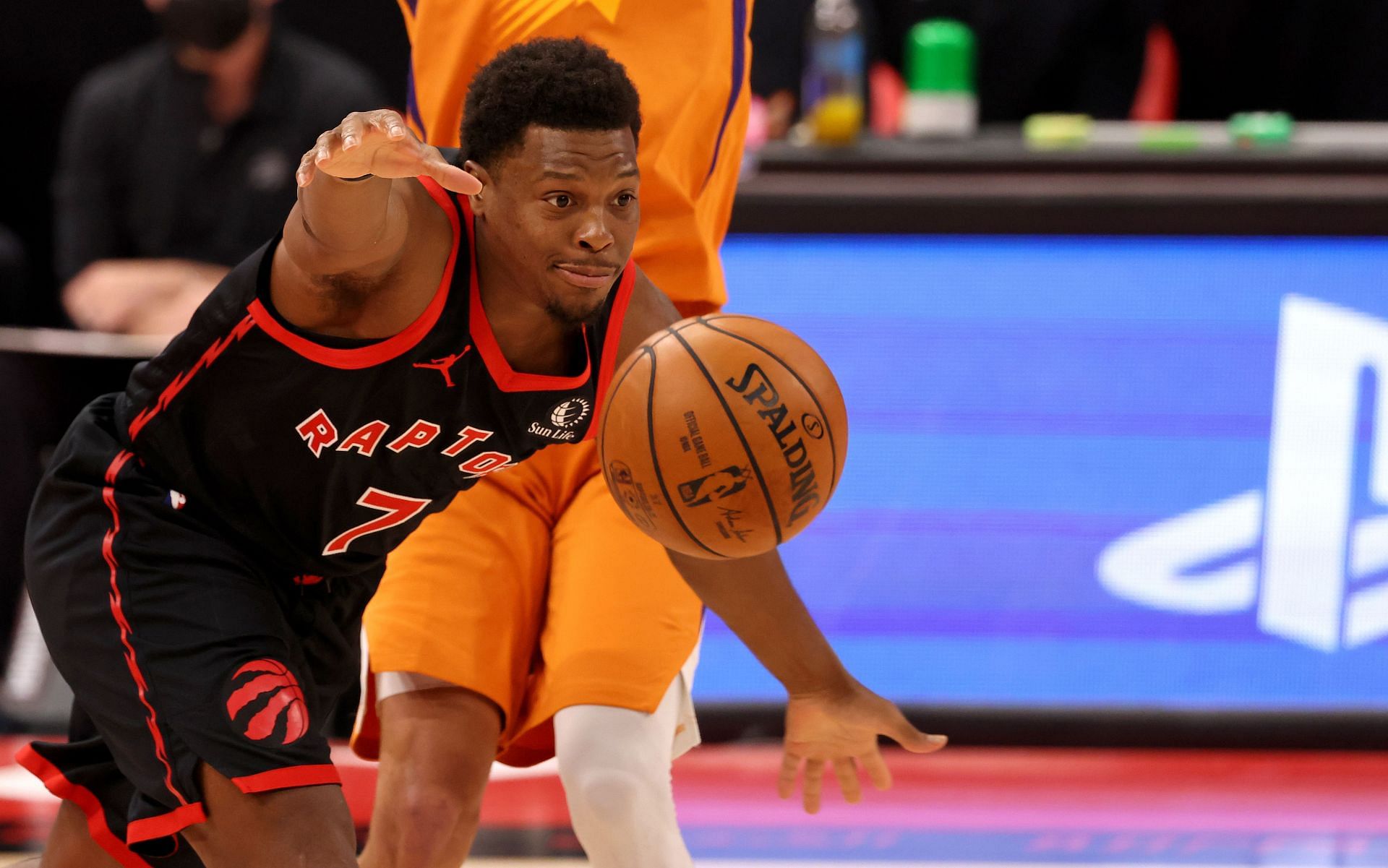 Kyle Lowry #7 of the Toronto Raptors passes during a game against the Phoenix Suns at Amalie Arena on March 26, 2021 in Tampa, Florida.