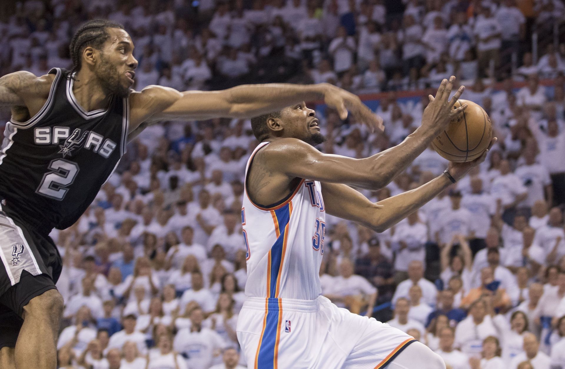 Kevin Durant #35 of the Oklahoma City Thunder shoots two points as Kawhi Leonard #2 of the San Antonio Spurs tries to block