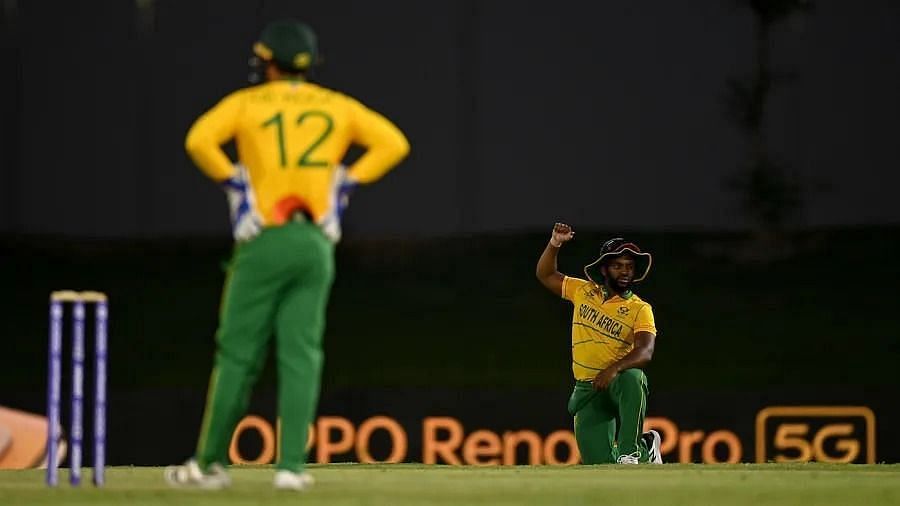 Quinton de Kock (L) has apologised for not taking a knee.