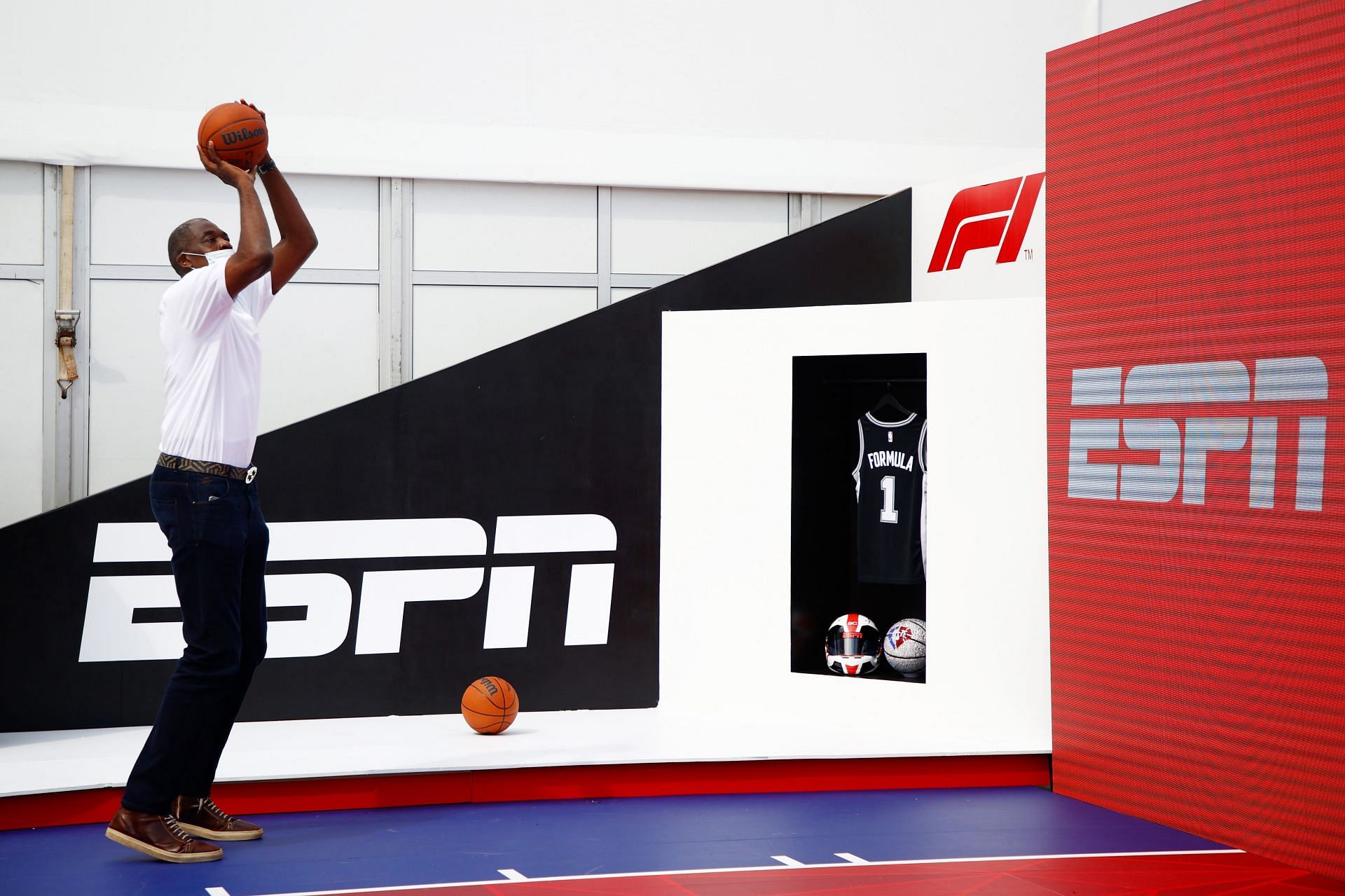 NBA legend Dikembe Mutombo plays basketball on the NBA court in the F1 Paddock ahead of the USGP. (Photo by Jared C. Tilton/Getty Images)