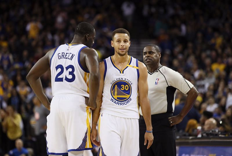 Stephen Curry #30 and Draymond Green #23 of the Golden State Warriors complain to referee Leroy Richardson during their game against the New Orleans Pelicans at ORACLE Arena on November 7, 2016 in Oakland, California.