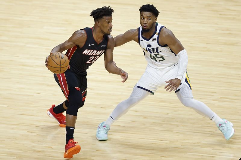 Donovan Mitchell looks for help as Jimmy Butler drives to the rack