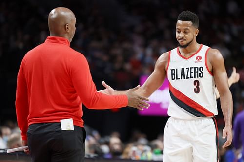 Portland Trail Blazers head coach Chauncey Billups and CJ McCollum high-five each other during a game