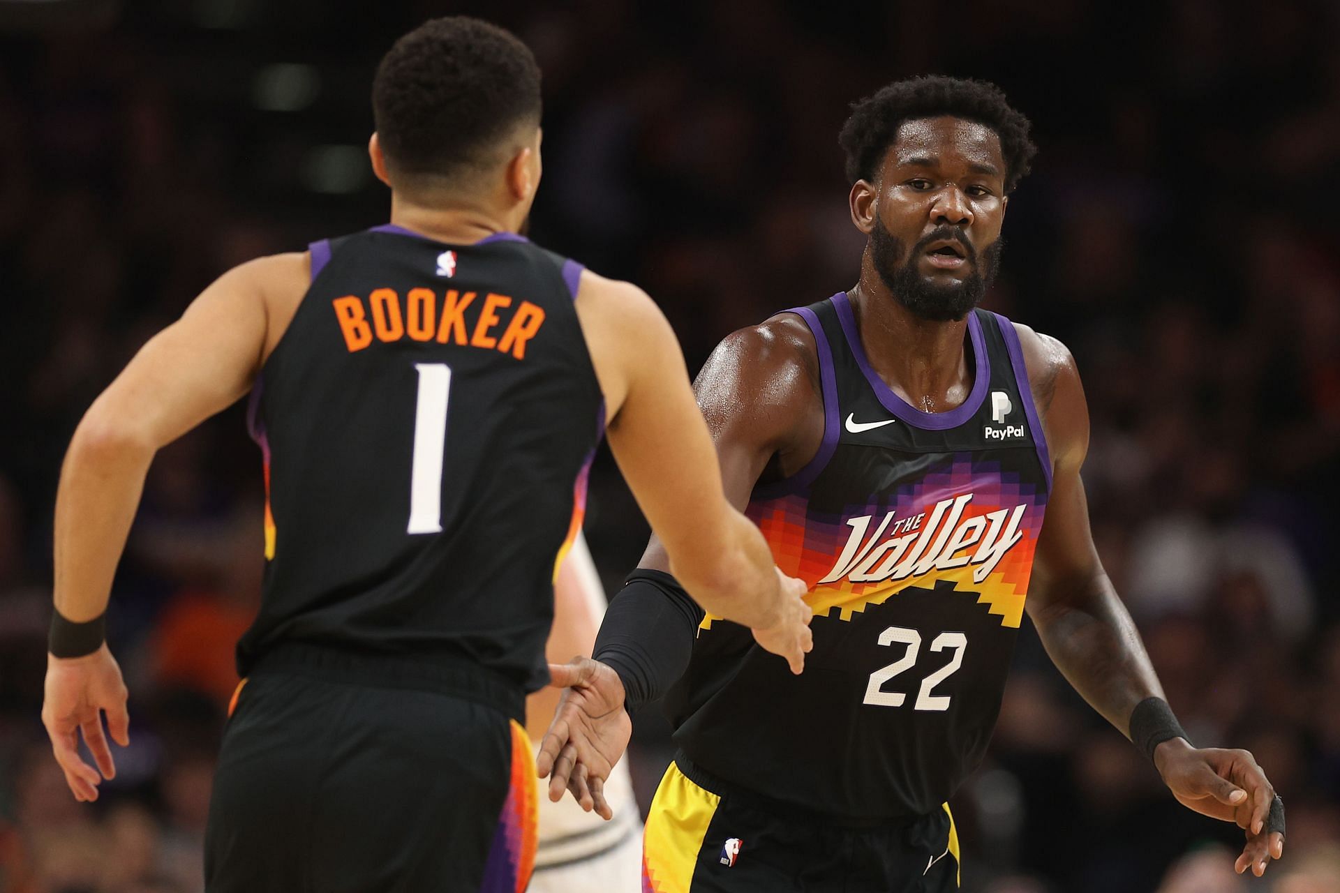 Devin Booker and Deandre Ayton (right) of the Phoenix Suns against the Denver Nuggets