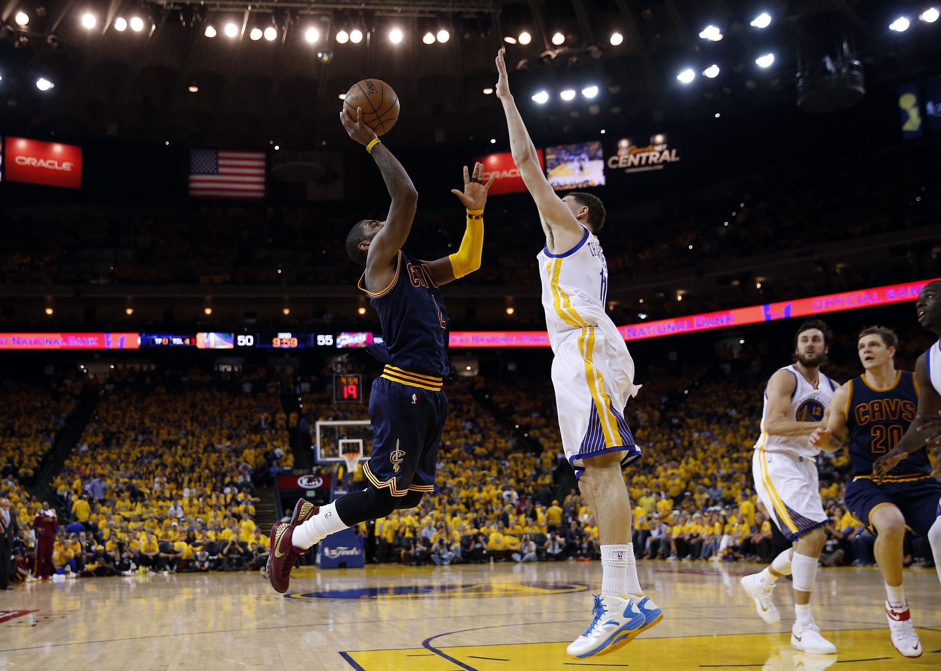 Kyrie Irving (#2) of the Cleveland Cavaliers goes up against Klay Thompson (#11) of the Golden State Warriors