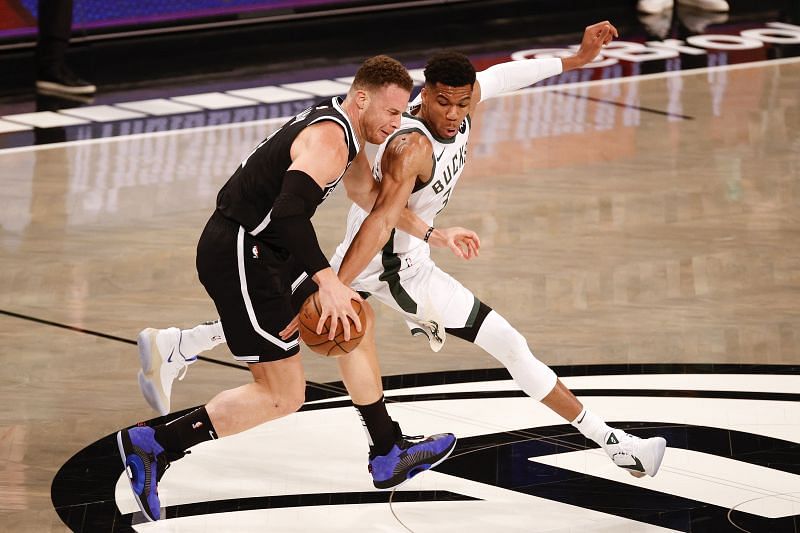 Giannis Antetokounmpo steals the ball from Blake Griffin (#2) of the Brooklyn Nets.
