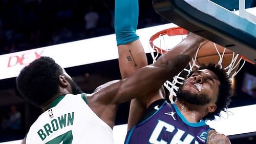 Jaylen Brown slams it home against Miles Bridges in a game between the Boston Celtics and the Charlotte Hornets [Photo: NBC Sports]