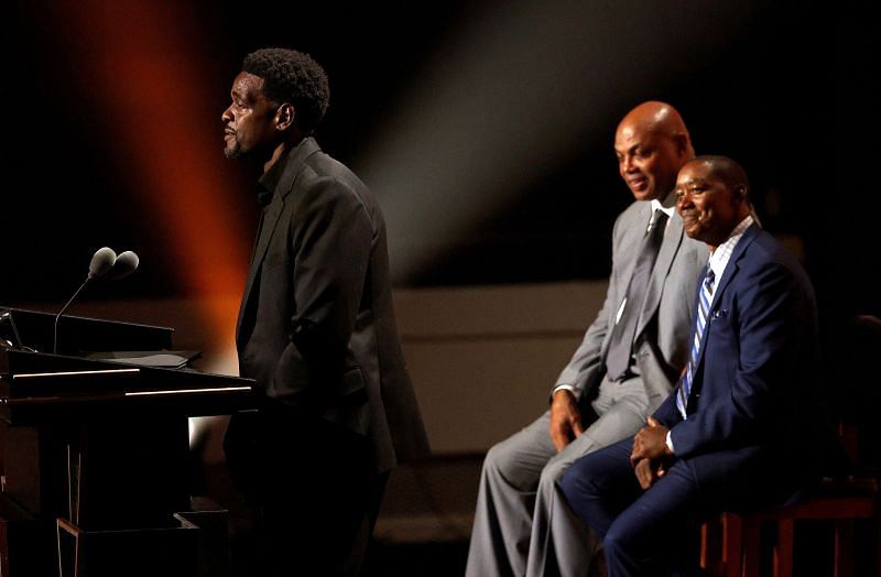 Charles Barkley and Isiah Thomas present Chris Webber during the 2021 Naismith Memorial Basketball Hall of Fame ceremony.