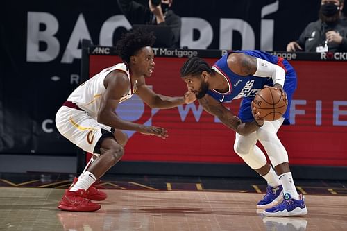 Collin Sexton of the Cleveland Cavaliers guarding LA Clippers' Paul George