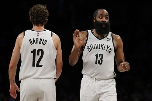 James Harden #13 high-fives Joe Harris #12 of the Brooklyn Nets