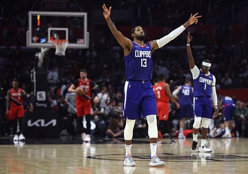 LA Clippers star Paul George celebrating a Blazers' foul on a Kennard three