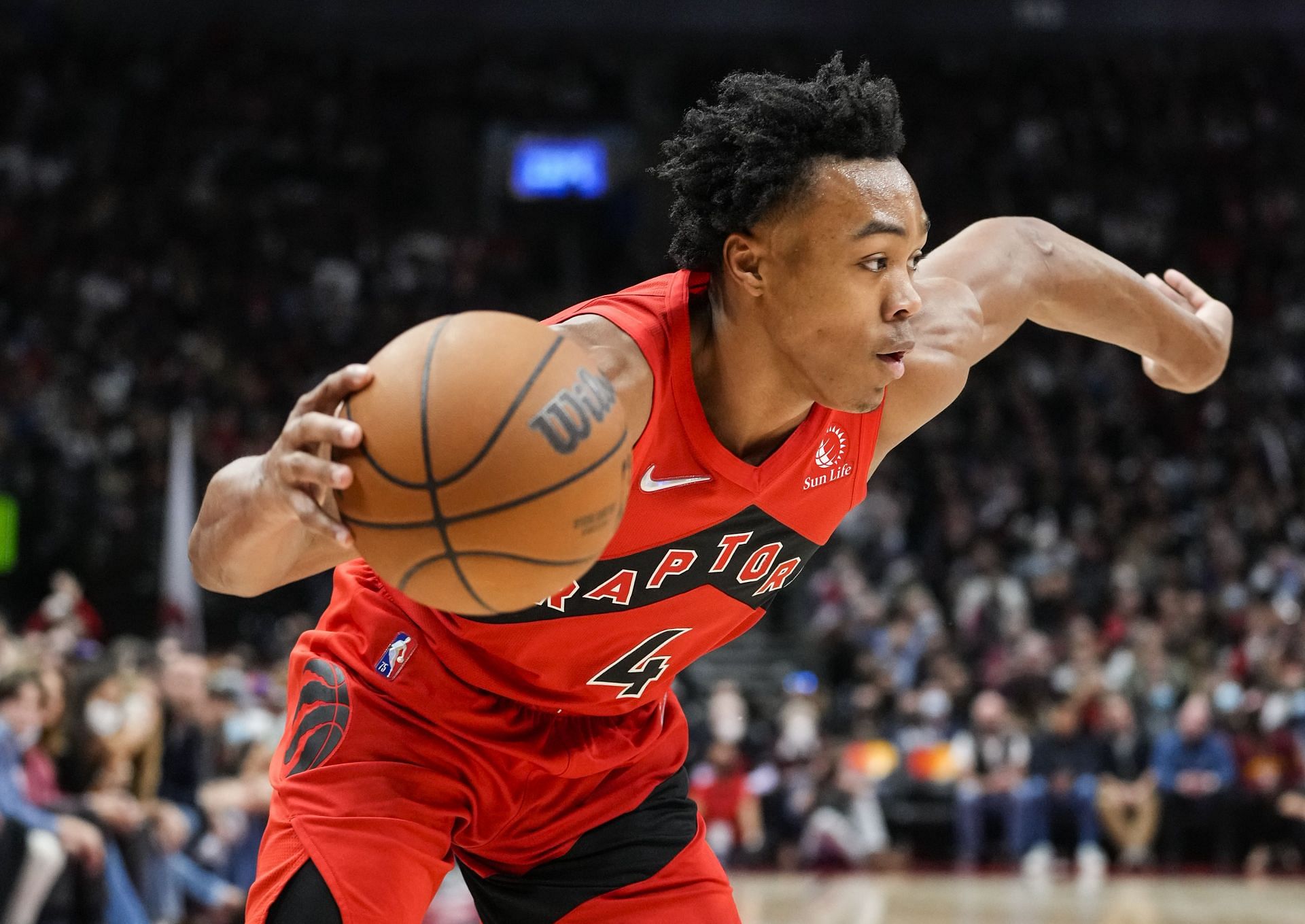Scottie Barnes #4 of the Toronto Raptors dribbles against the Washington Wizards during the second half of their basketball game at Scotiabank Arena on October 20, 2021 in Toronto, Canada.