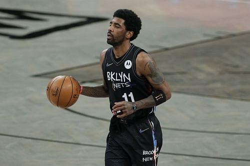 Kyrie Irving of the Brooklyn Nets surveys the floor in a game against the Chicago Bulls