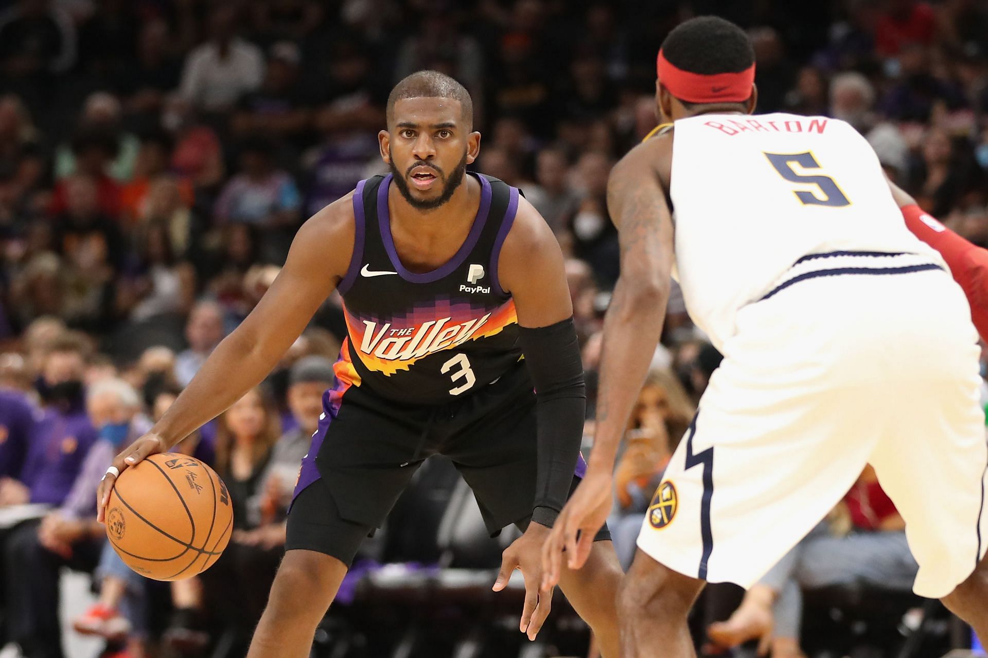 Chris Paul of the Phoenix Suns in action against the Denver Nuggets.
