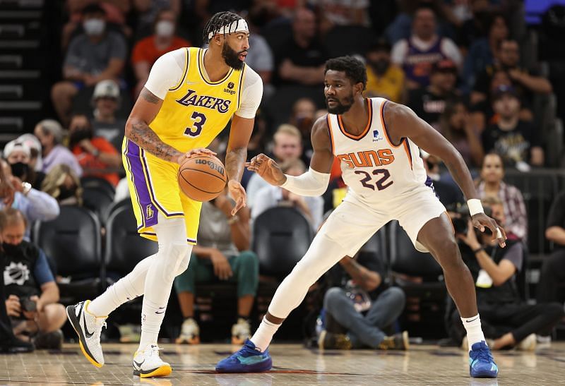 Deandre Ayton of the Phoenix Suns guards LA Lakers&#039; Anthony Davis in the preseason game