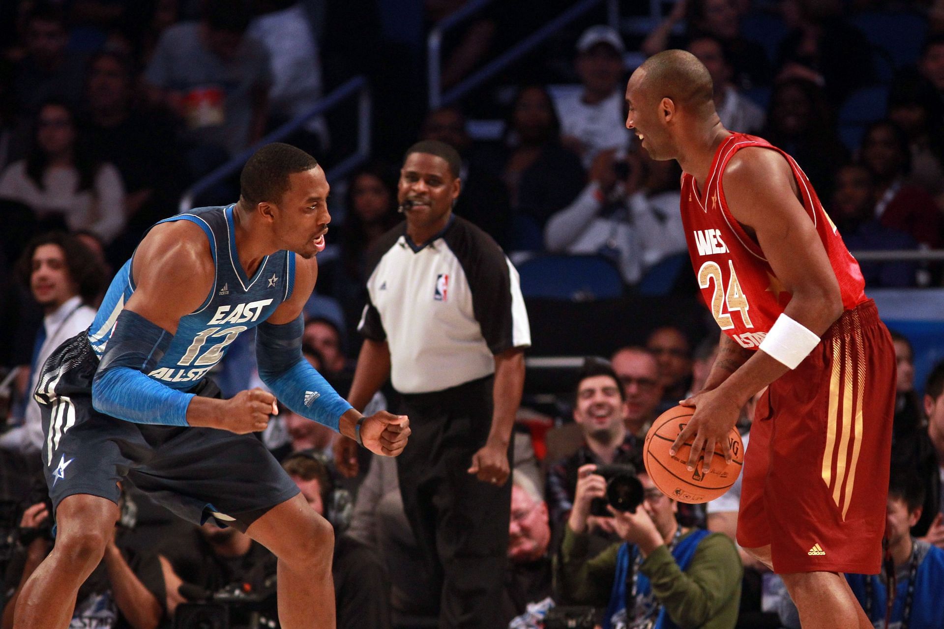 Kobe Bryant #24 of the Los Angeles Lakers and the Western Conference looks to pass as he is defended by Dwight Howard. 2012 NBA All-Star Game.