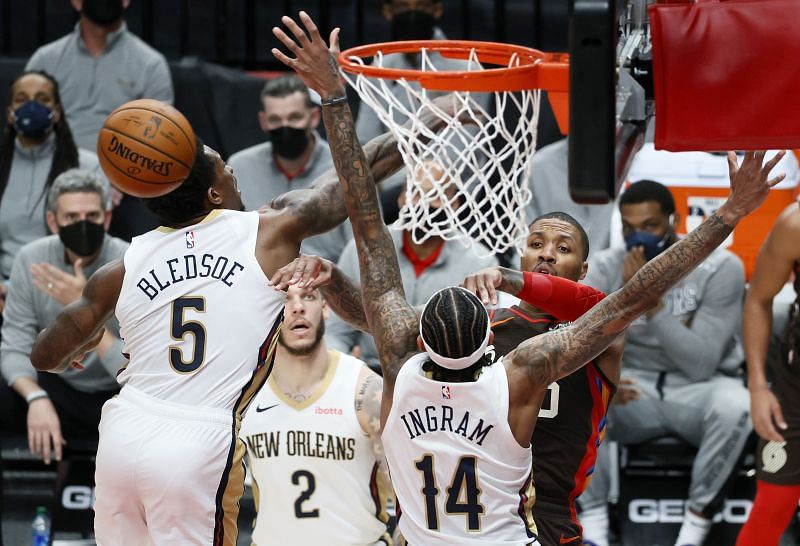 Damian Lillard passing out of a double team against the New Orleans Pelicans