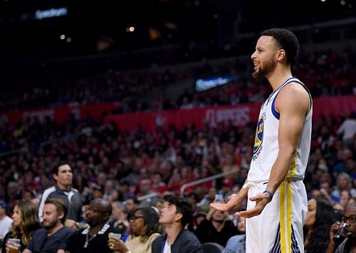 Golden State Warriors star Stephen Curry reacts to a foul during an NBA game