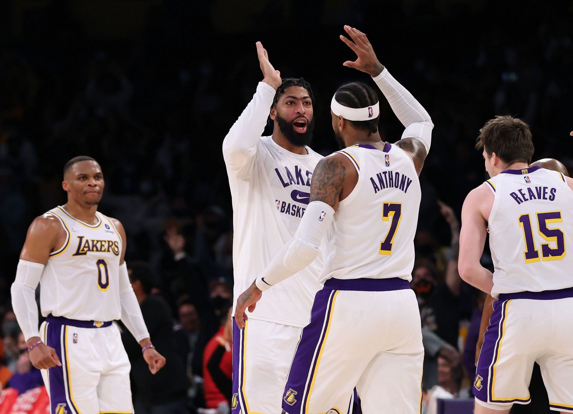 The LA Lakers celebrate while heading to the bench after a timeout.
