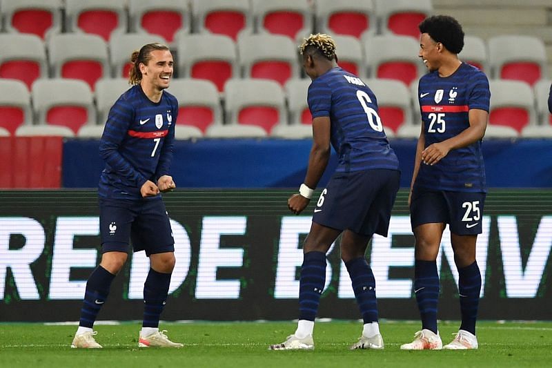 Antoine Griezmann, Paul Pogba and Jules Kounde of France