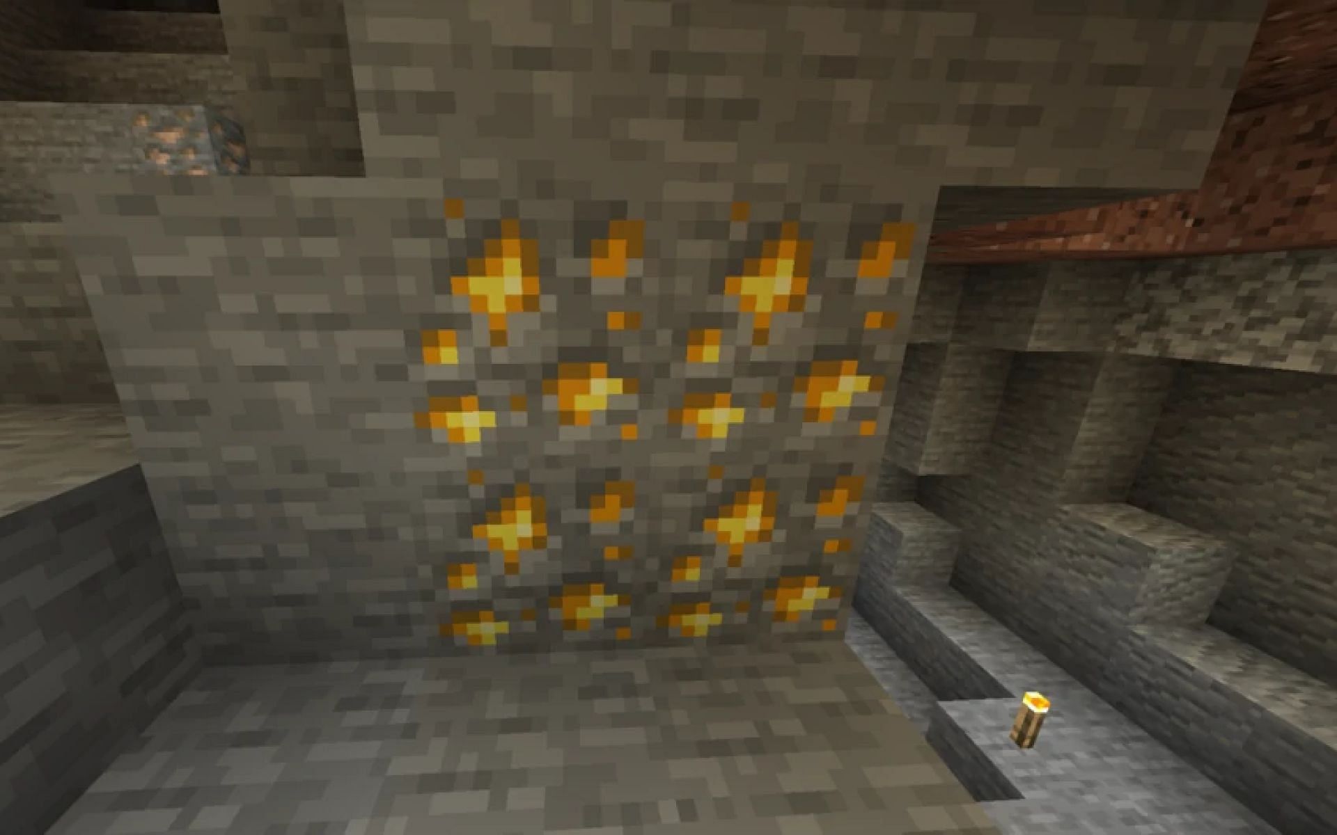 Gold ore can be found in the Overworld (Image via Minecraft)