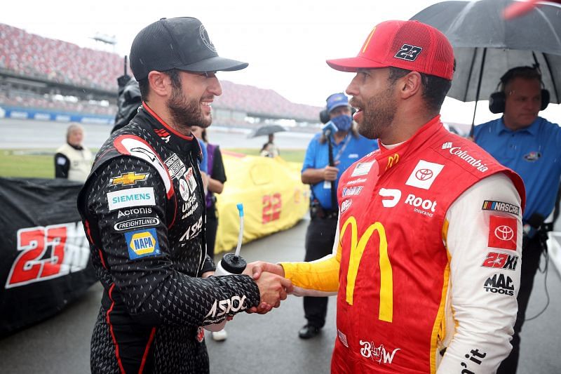 Chase Elliott congratulates Bubba Wallace on a potential win during a rain delay late in the YellaWood 500 at Talladega Superspeedway. (Photo by Chris Graythen/Getty Images)