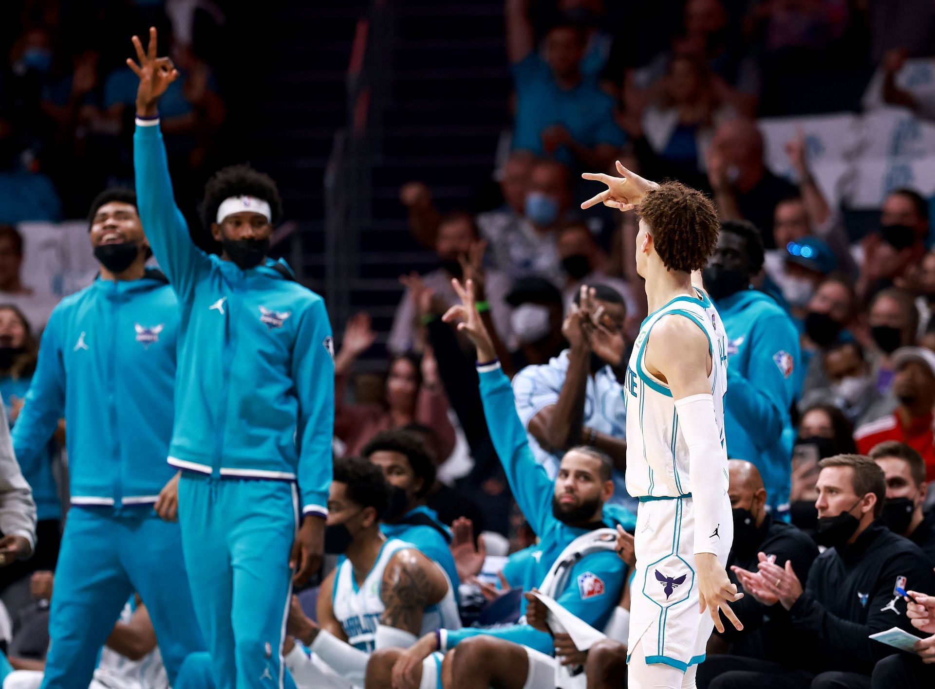 Charlotte Hornets bench celebrates a three-pointer by LaMelo Ball in a game