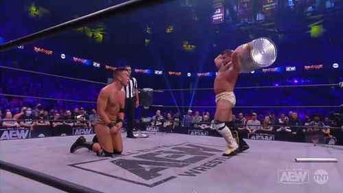 AEW star Brian Cage hitting Ricky Starks with a trash can