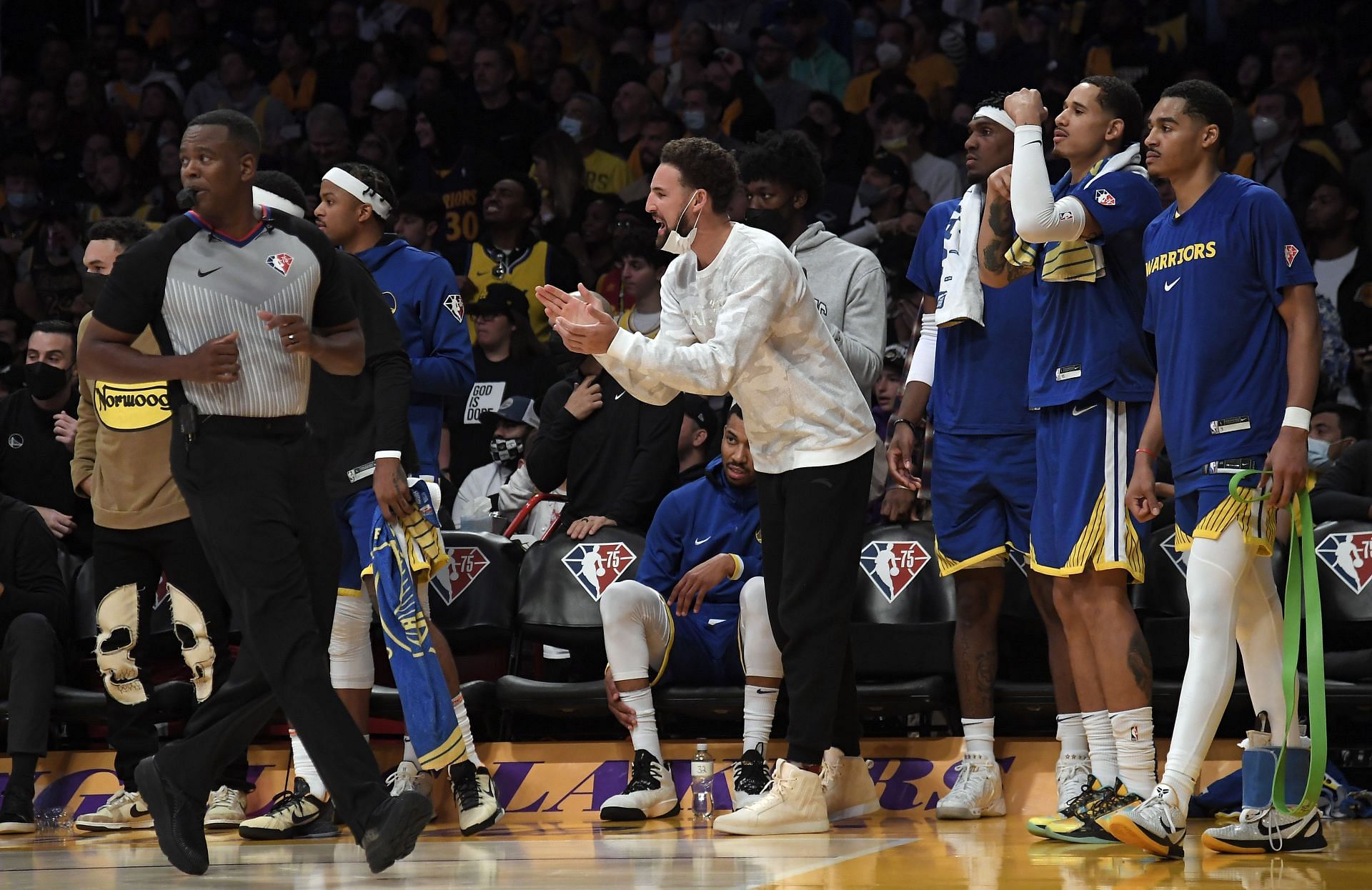 The Golden State Warriors bench reacts to a play vs the LA Lakers