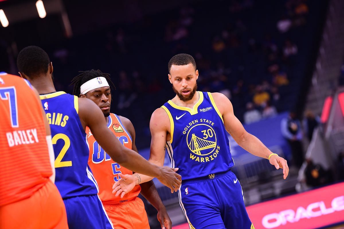 Stephen Curry and Andrew Wiggins of the Golden State Warriors vs Oklahoma City Thunder&#039;s Lu Dort