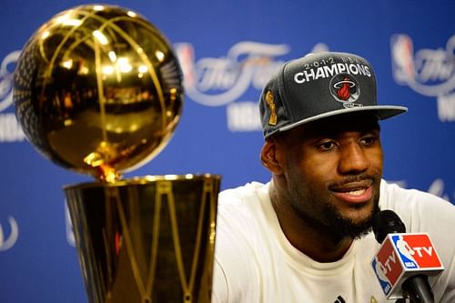 LeBron James and the Larry O'Brien trophy.