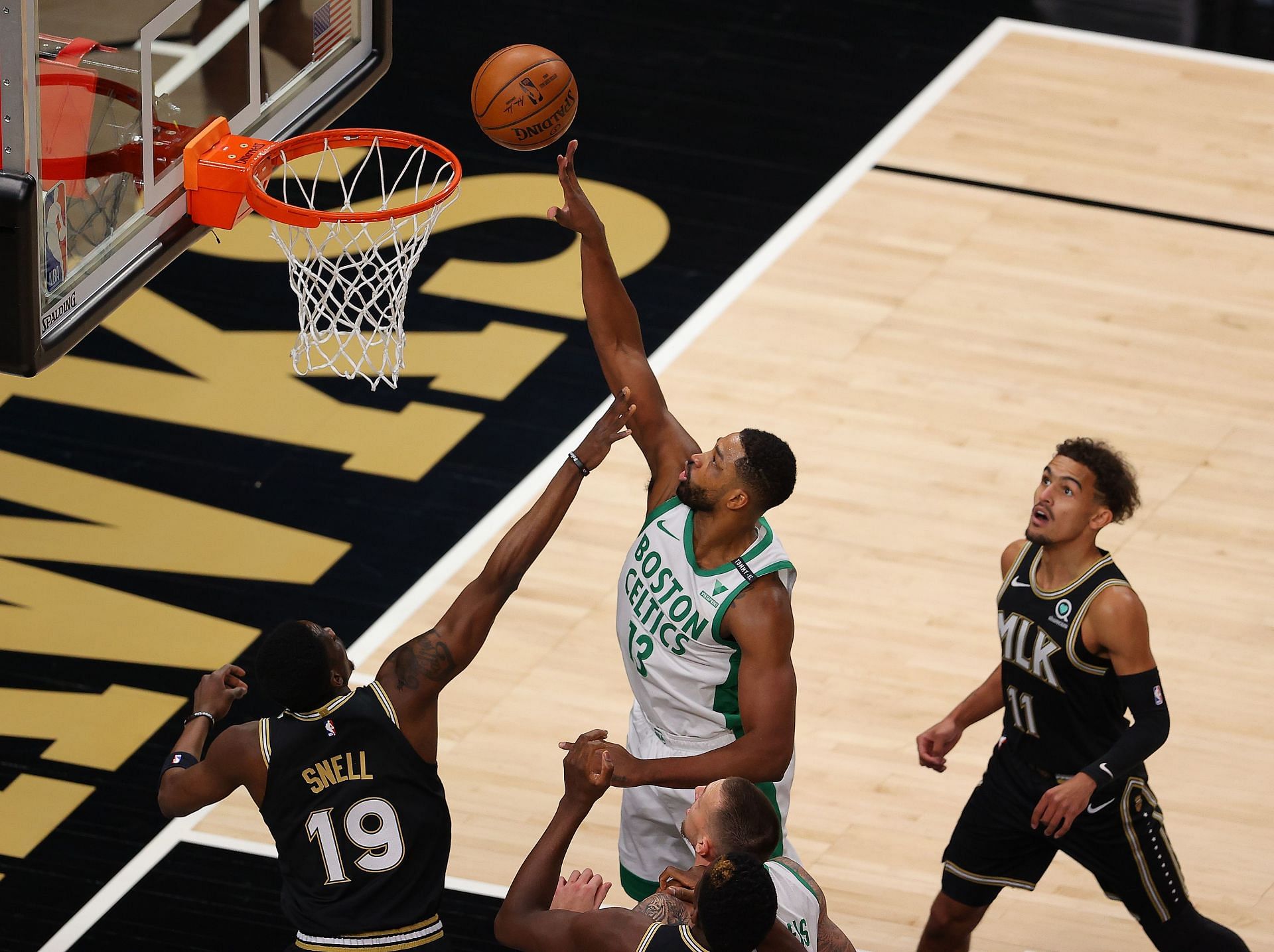 Former Boston Celtics center Tristan Thompson tipping in a rebound against the Atlanta Hawks