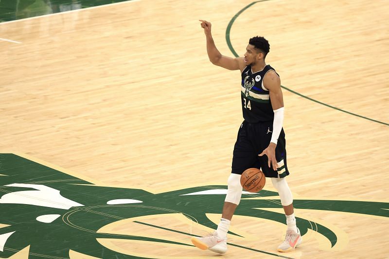 Giannis Antetokounmpo #34 of the Milwaukee Bucks brings the ball up court against the Phoenix Suns during the second half in Game Six of the NBA Finals at Fiserv Forum on July 20, 2021 in Milwaukee, Wisconsin.