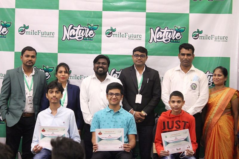 Grandmaster Raunak Sadhwani (seated Centre) with other winners and officials