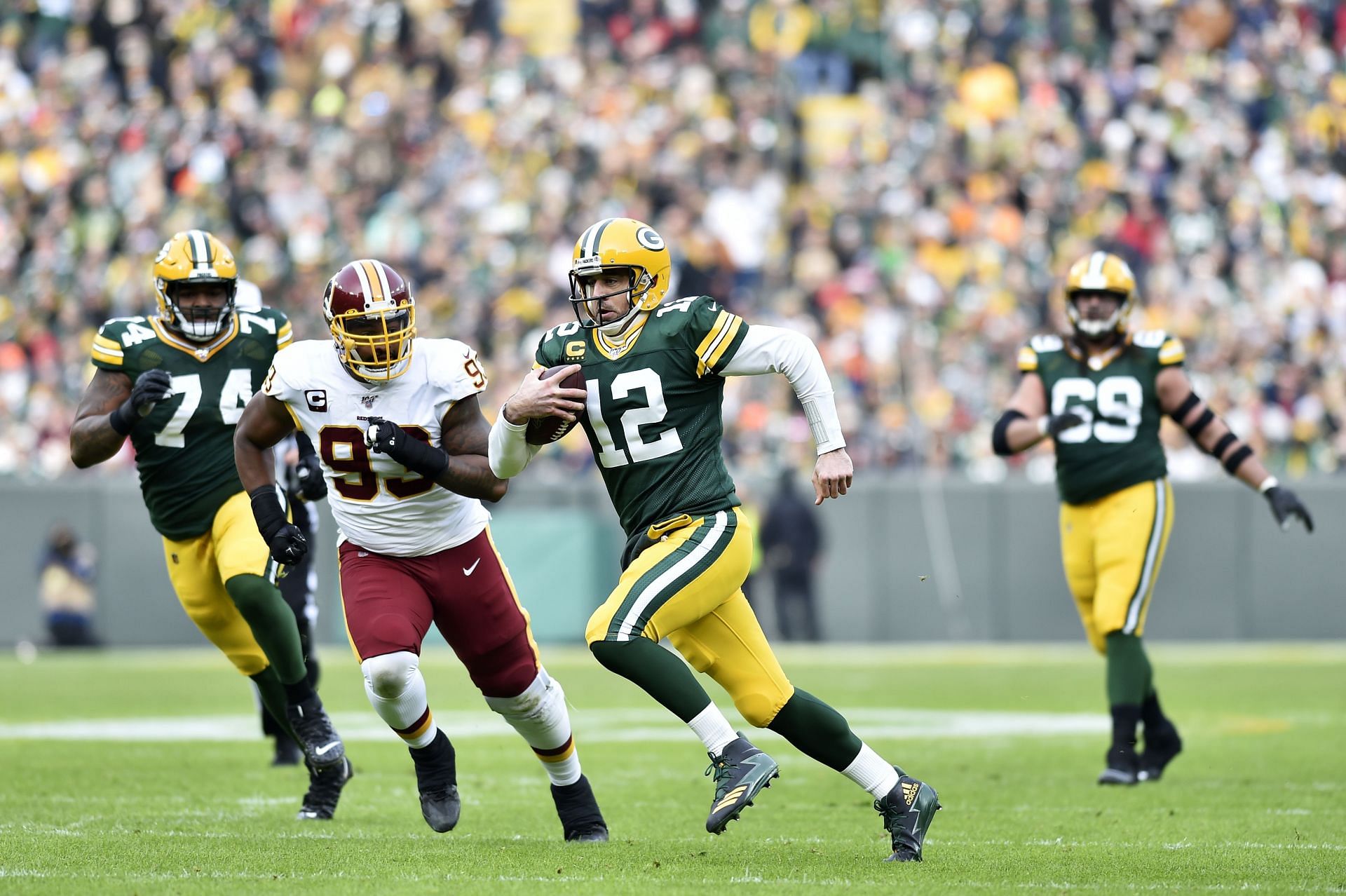 Aaron Rodgers in a rushing play against the Washington Football Team
