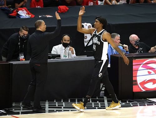 Terance Mann high-fives head coach Ty Lue during Phoenix Suns vs LA Clippers - Game Three