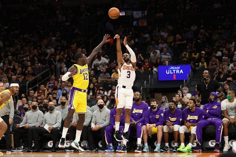 Chris Paul of the Phoenix Suns takes a three-pointer over LA Lakers&#039; Kendrick Nunn.