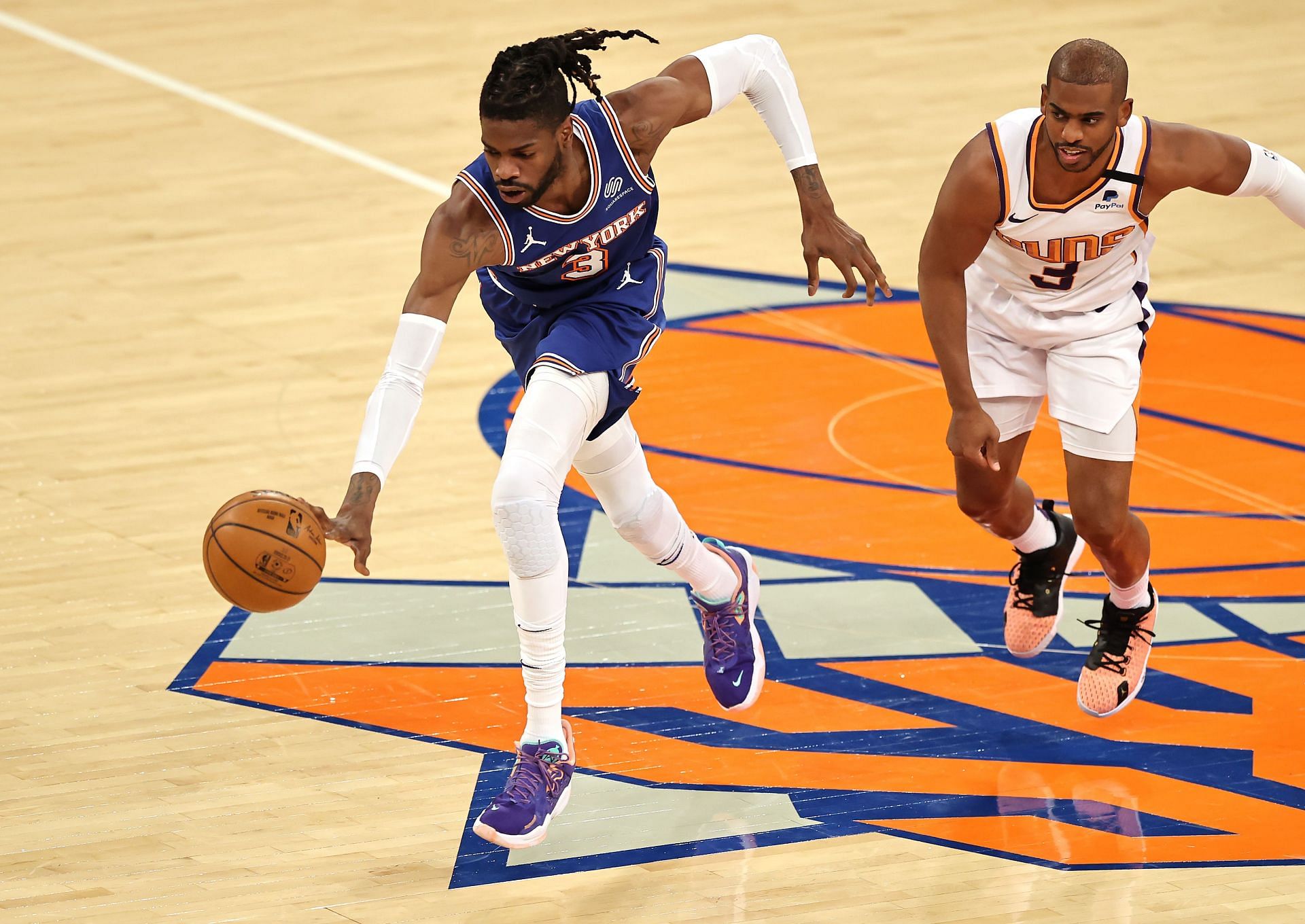 Nerlens Noel #3 of the New York Knicks steals the ball from Chris Paul #3 of the Phoenix Suns