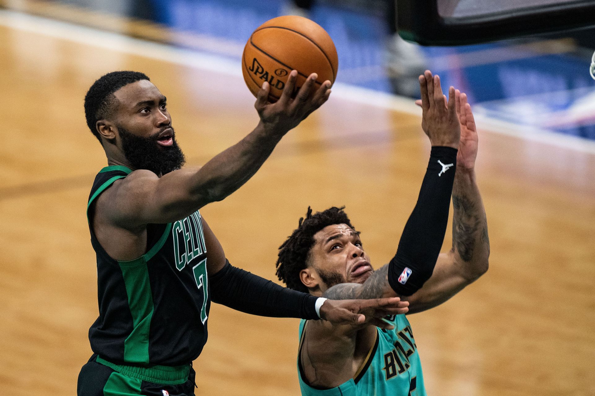 Jaylen Brown of the Boston Celtics scores over Charlotte Hornets&#039; Miles Bridges