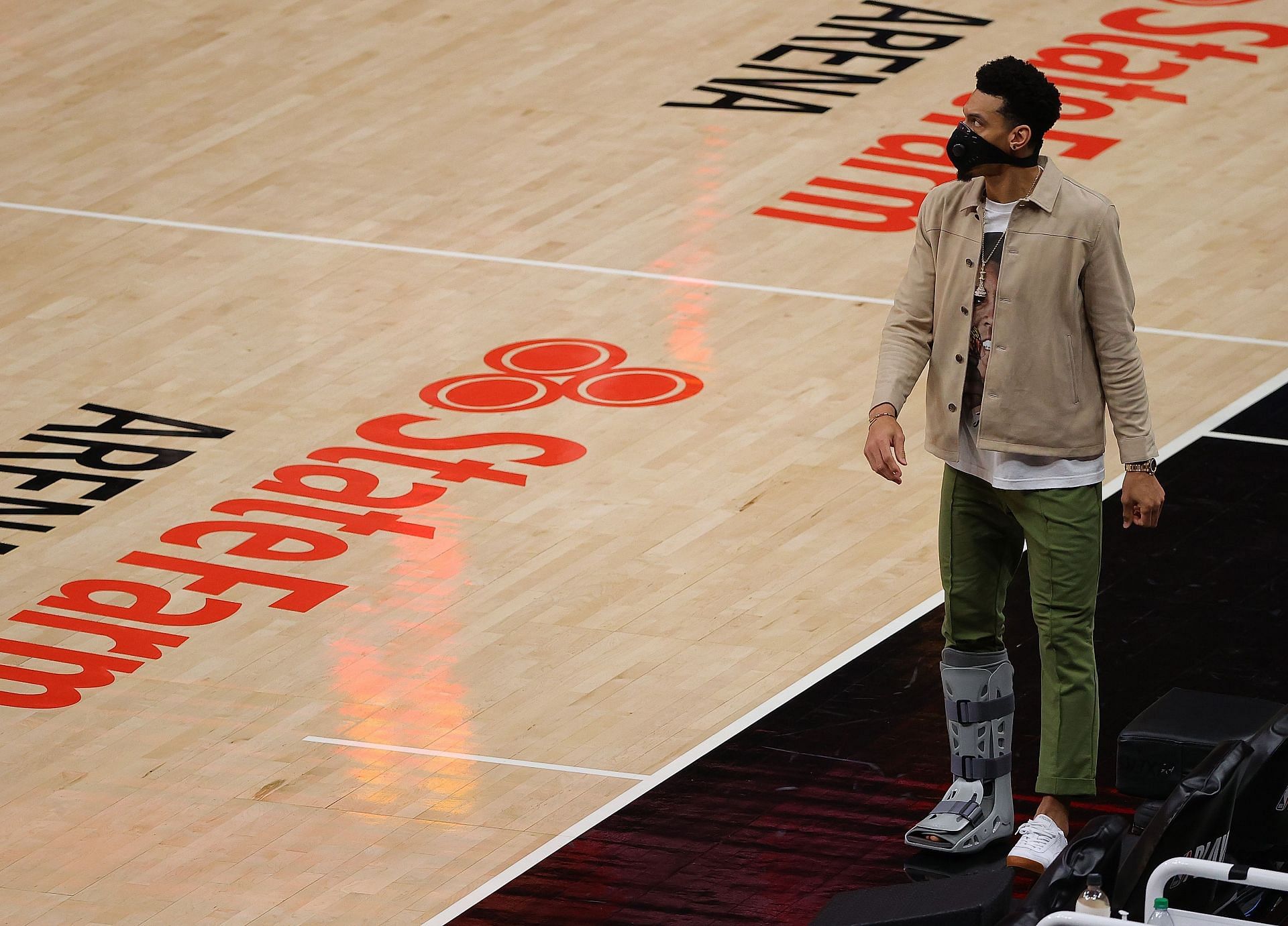 Danny Green #14 of the Philadelphia 76ers walks with a boot on his right leg in the second half after an injury in the first half against the Atlanta Hawks in game 3 of the Eastern Conference Semifinals at State Farm Arena on June 11, 2021 in Atlanta, Georgia.