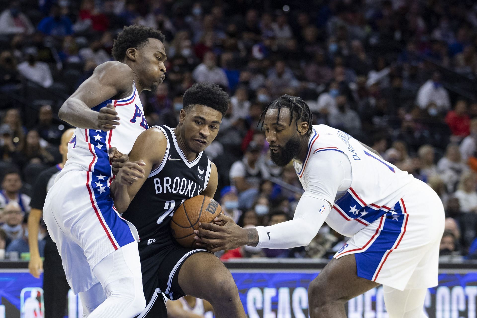 Cam Thomas of the Brooklyn Nets drives against Andre Drummond