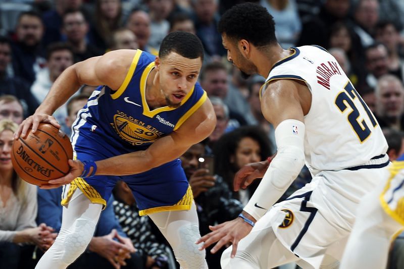 Stephen Curry of the Golden State Warriors against Denver Nuggets&#039; Jamal Murray [Source: Associated Press]